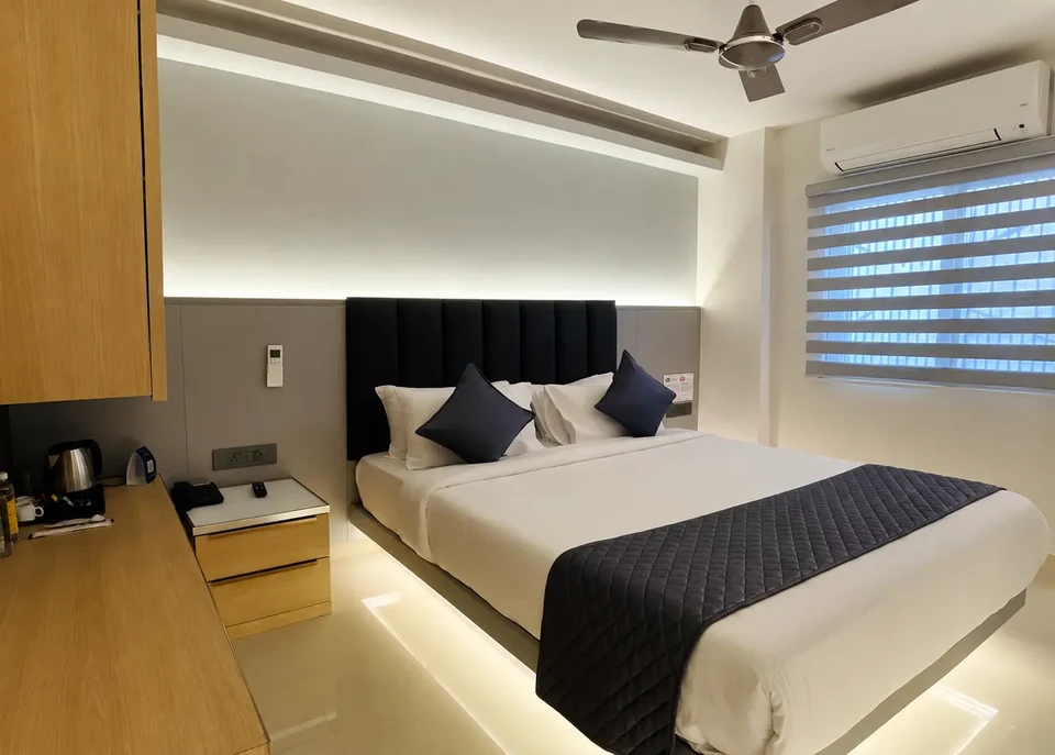 Standard Room with a double bed and bedside lighting